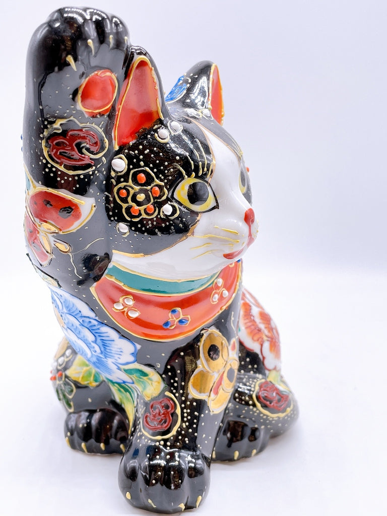 Japanese Kutani-style lucky cat with black butterfly design