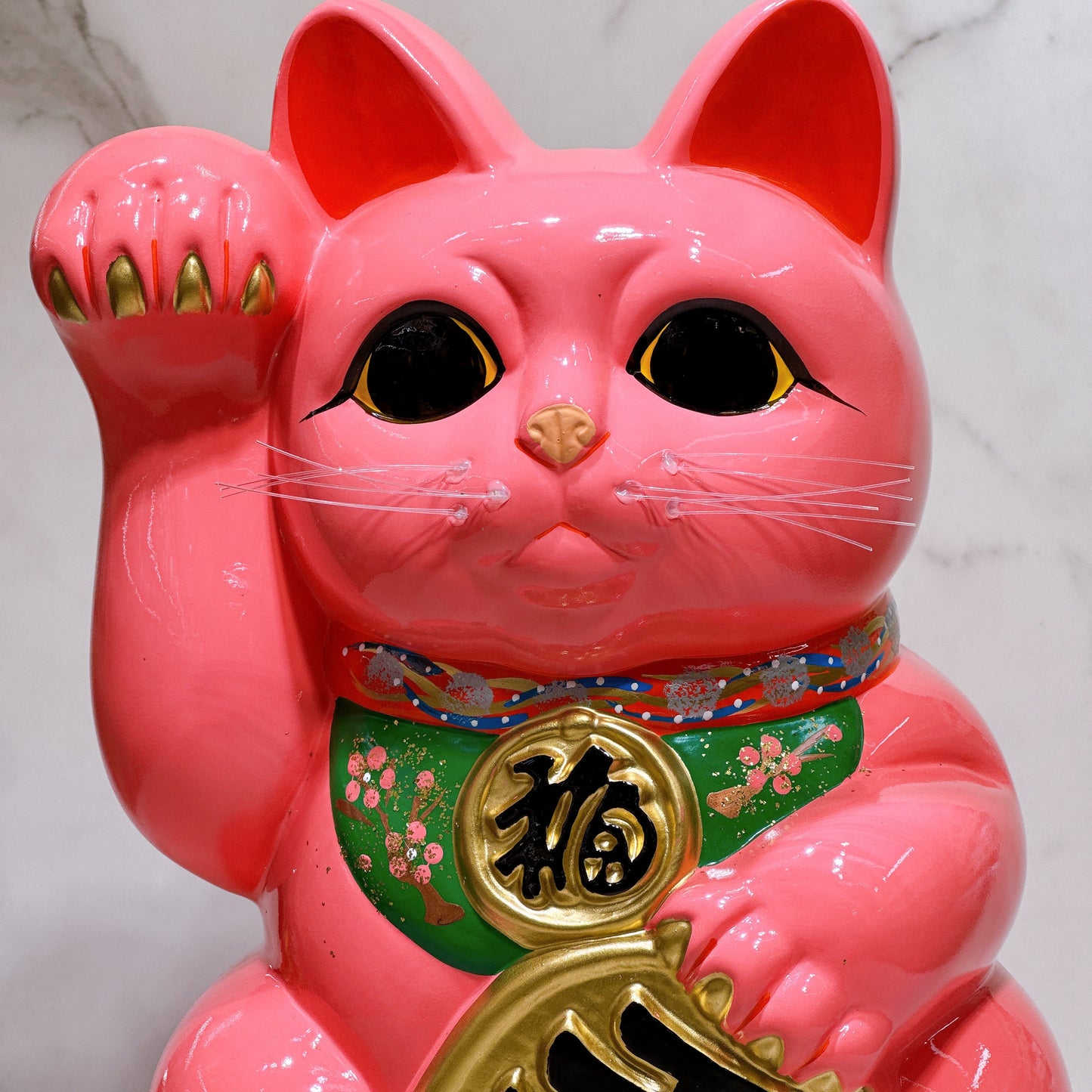 Japanese Tokoname Koban (approx. 10) lucky cat with cherry blossom pink color, left hand.