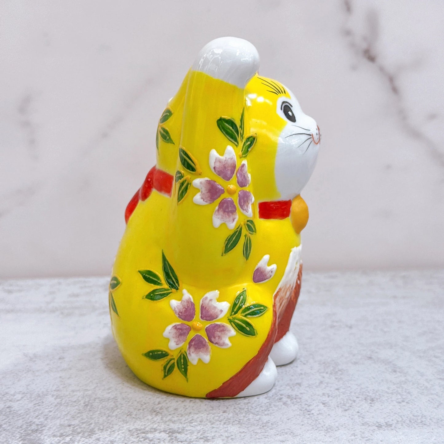 Japanese Kutani-yaki lucky cat with yellow background and purple Fuji cherry blossoms, No. 3.8