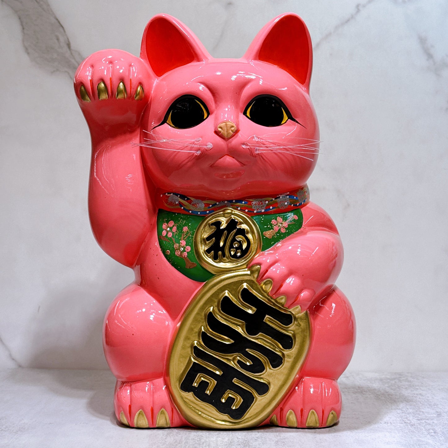 Japanese Tokoname Koban (approx. 10) lucky cat with cherry blossom pink color, left hand.