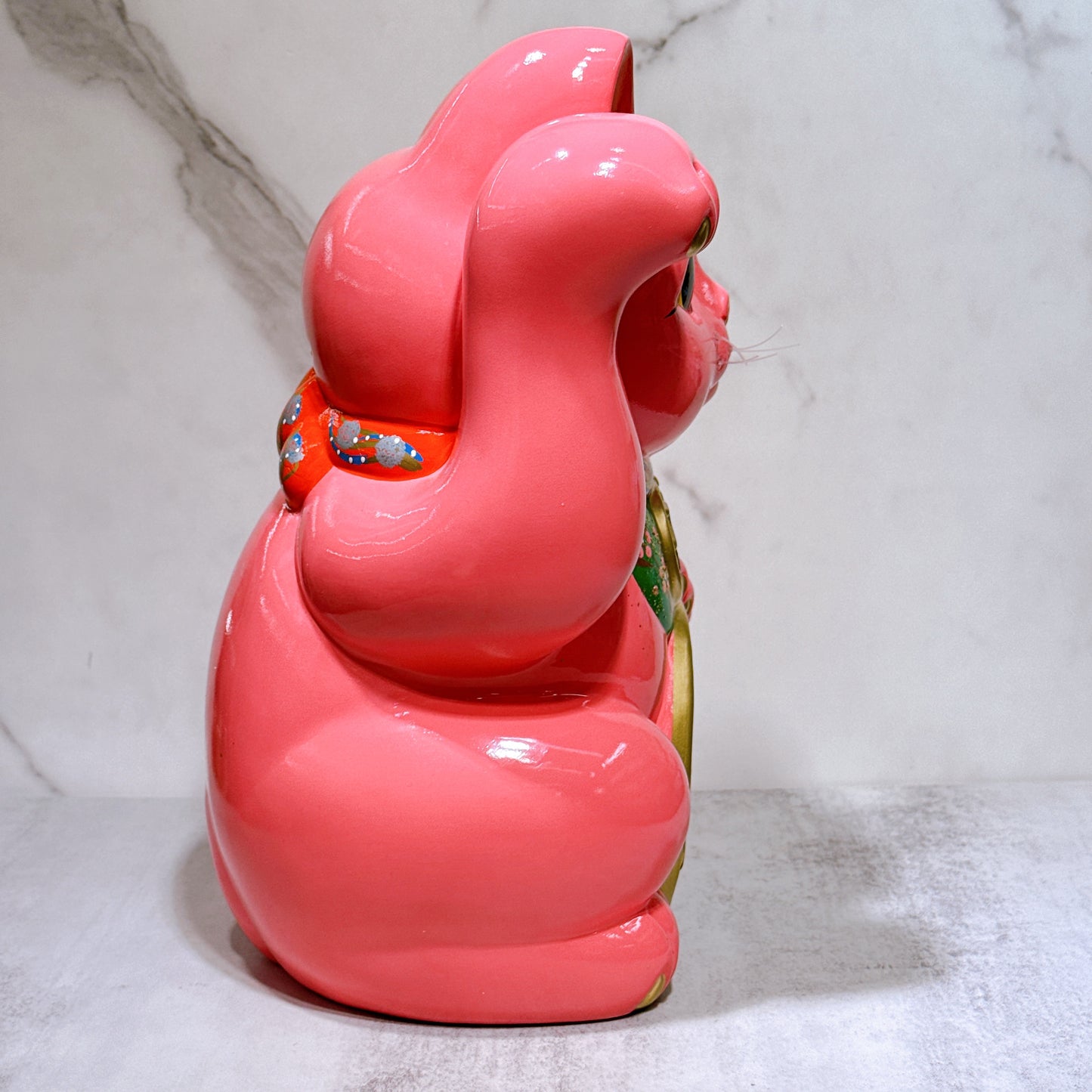 Japanese Tokoname Koban (approx. 10) lucky cat with cherry blossom pink color, left hand.
