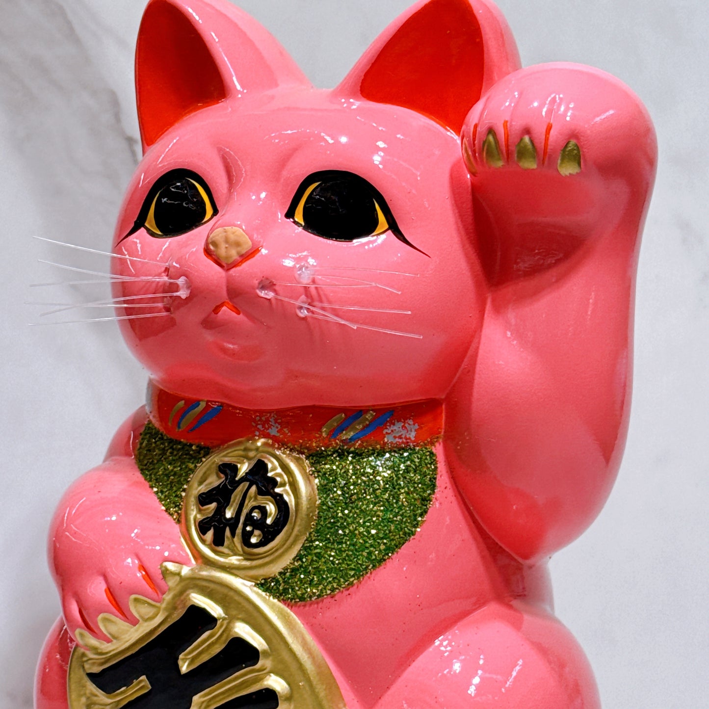 Japanese Tokoname Koban (approx. 10) lucky cat with cherry blossom pink color, left hand.