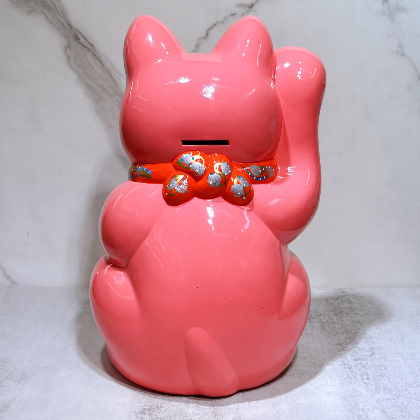 Japanese Tokoname Koban (approx. 10) lucky cat with cherry blossom pink color, left hand.