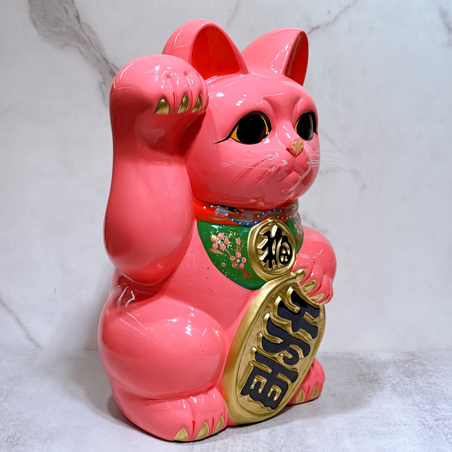 Japanese Tokoname Koban (approx. 10) lucky cat with cherry blossom pink color, left hand.