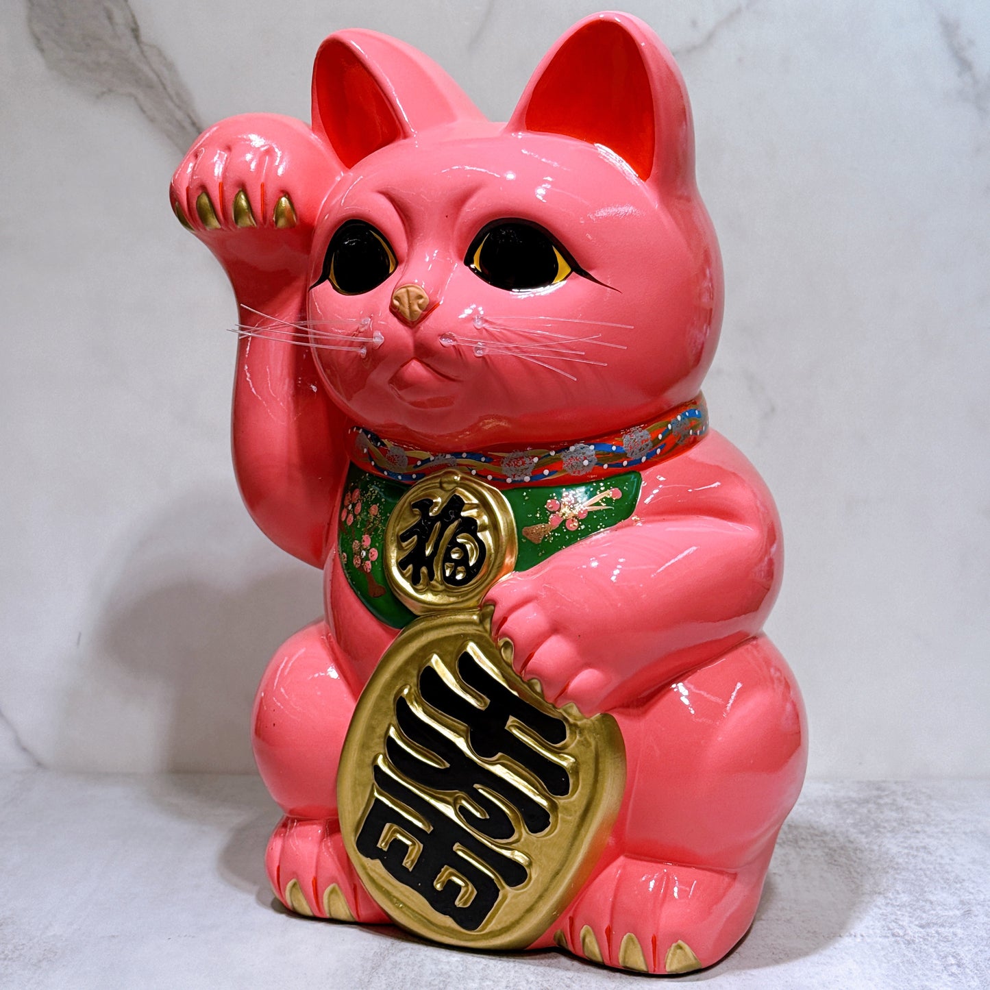 Japanese Tokoname Koban (approx. 10) lucky cat with cherry blossom pink color, left hand.
