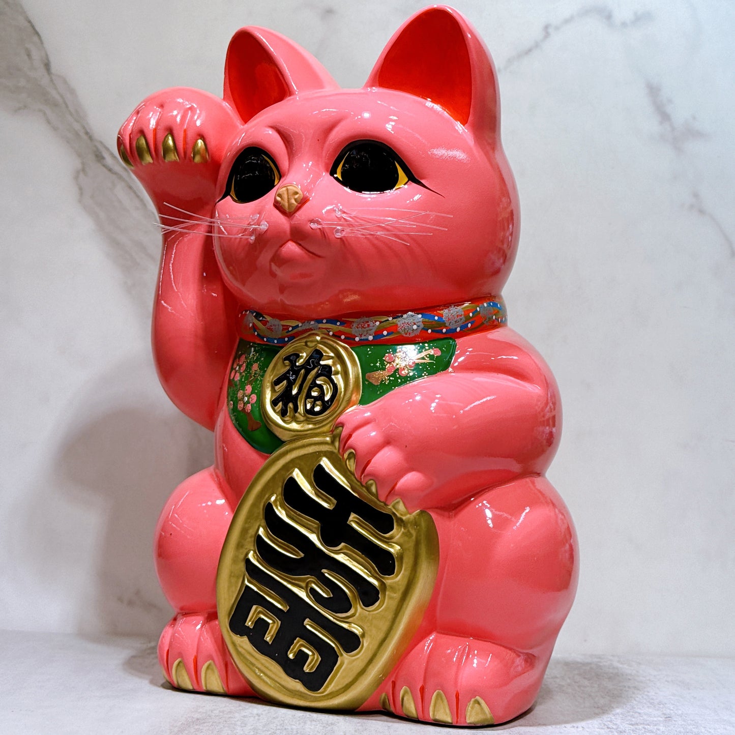 Japanese Tokoname Koban (approx. 10) lucky cat with cherry blossom pink color, left hand.