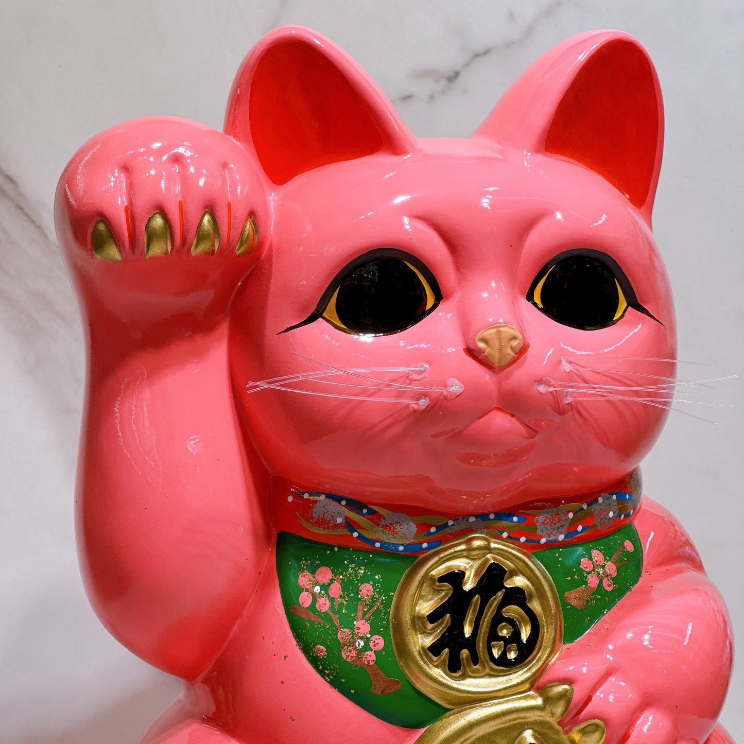 Japanese Tokoname Koban (approx. 10) lucky cat with cherry blossom pink color, left hand.