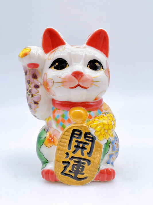 Japanese Kiyomizu-style lucky cat with spring flowers