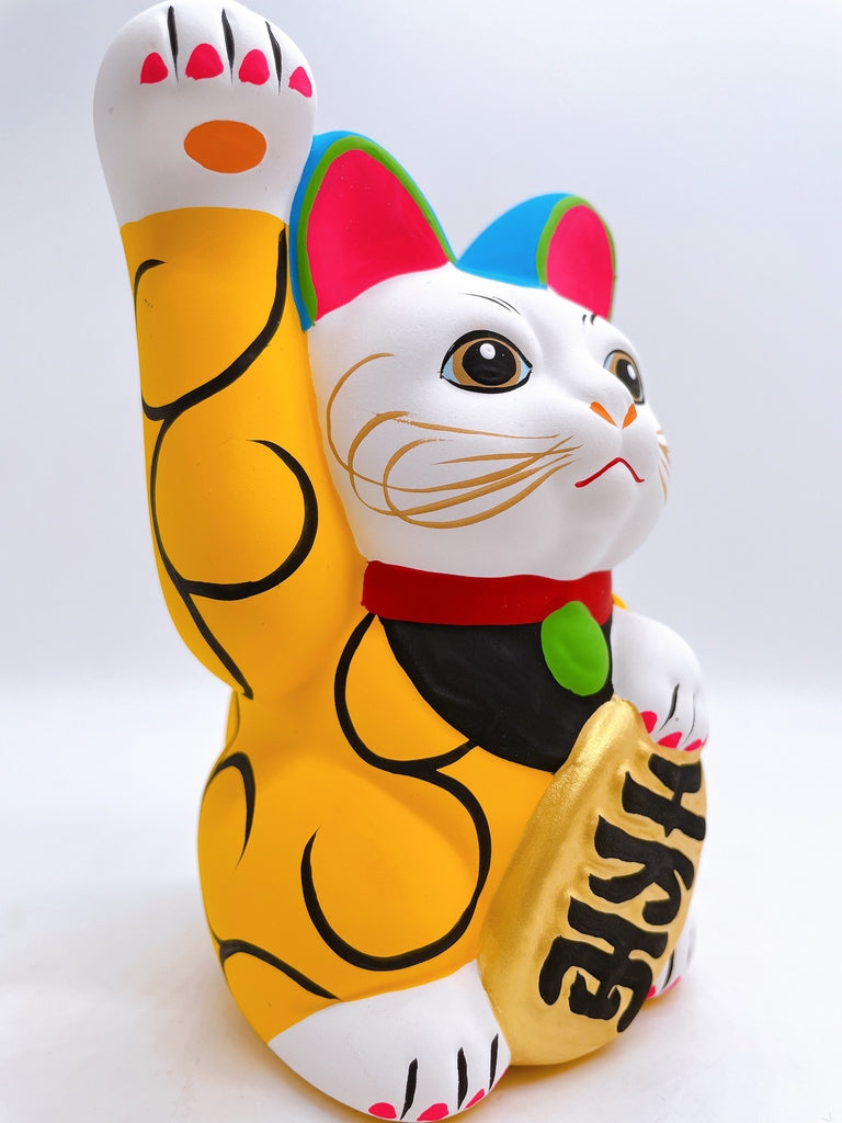 Japanese arabesque yellow lucky cat with a million taels of silver