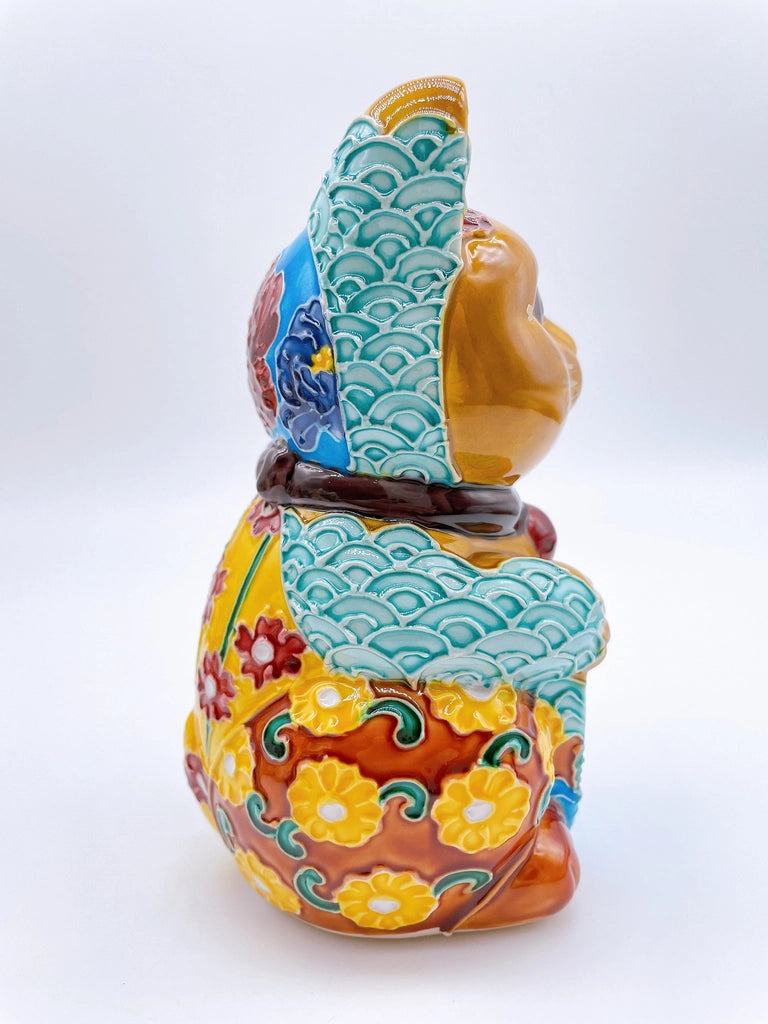Japanese Kiyomizu-style lucky cat with a yellowish-brown base.