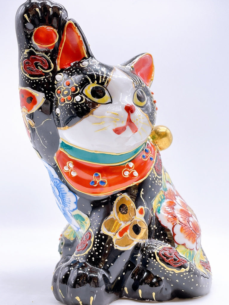Japanese Kutani-style lucky cat with black butterfly design