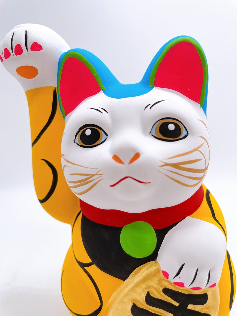 Japanese arabesque yellow lucky cat with a million taels of silver
