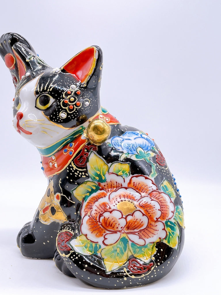 Japanese Kutani-style lucky cat with black butterfly design