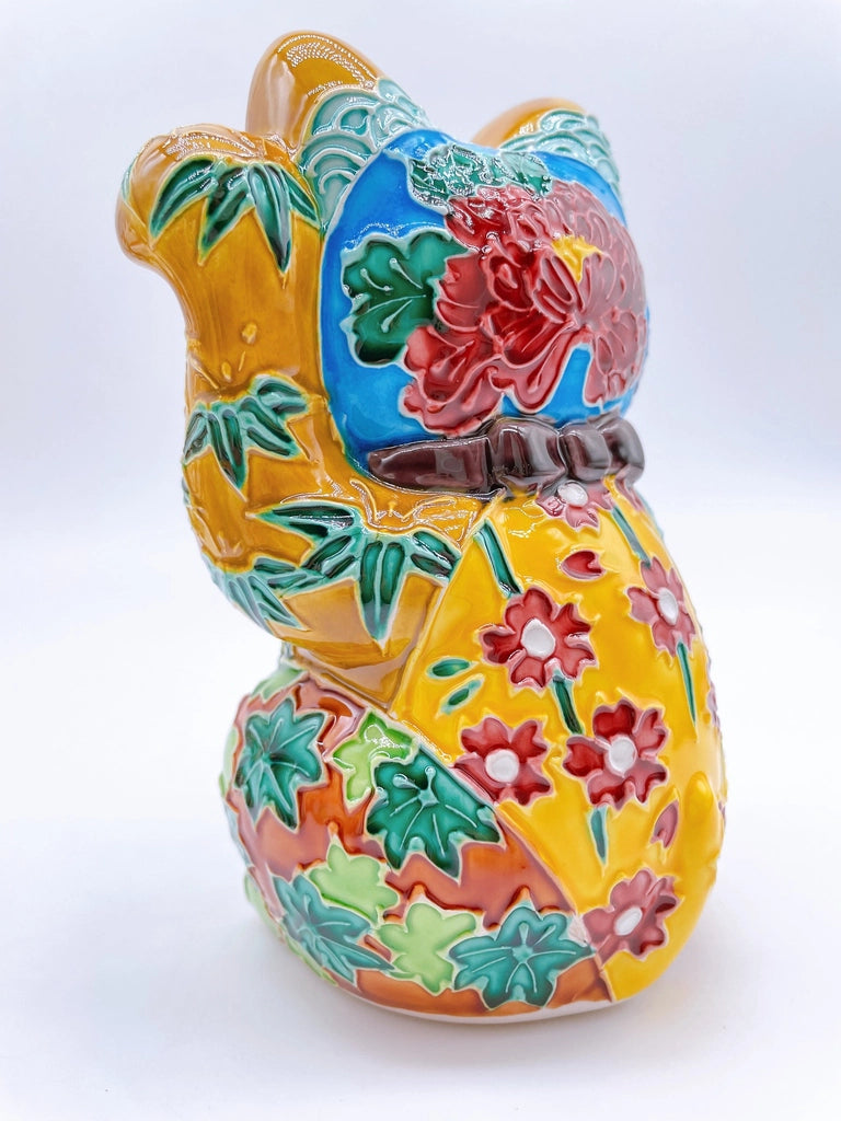 Japanese Kiyomizu-style lucky cat with a yellowish-brown base.