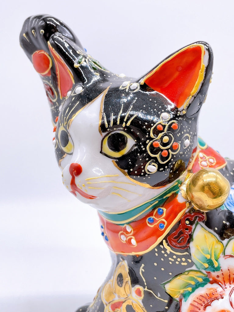 Japanese Kutani-style lucky cat with black butterfly design