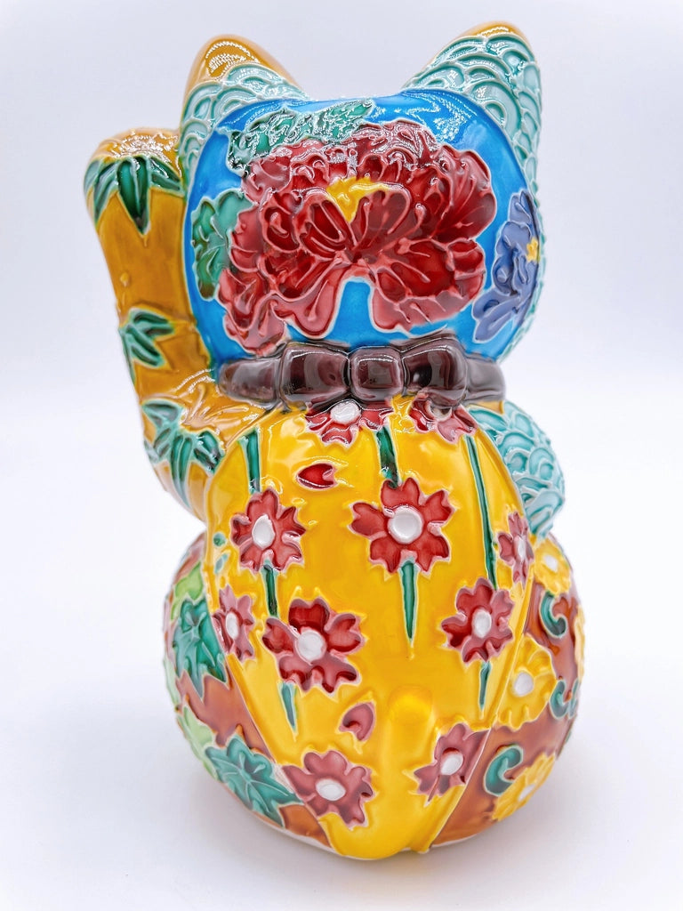Japanese Kiyomizu-style lucky cat with a yellowish-brown base.