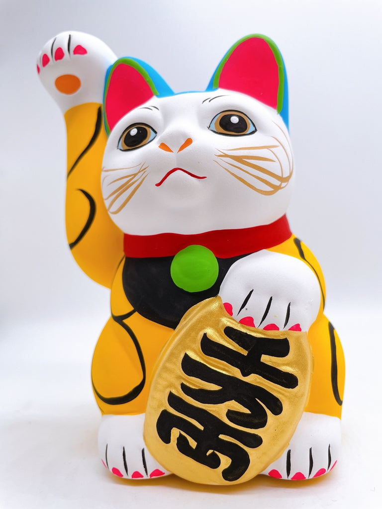 Japanese arabesque yellow lucky cat with a million taels of silver