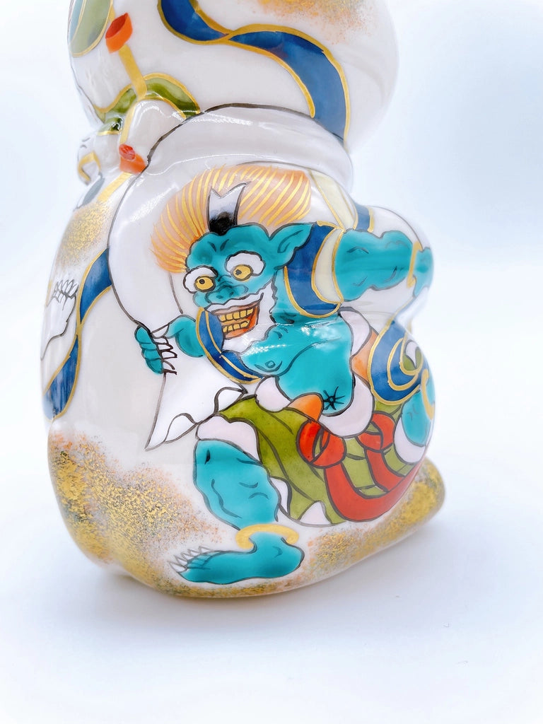 Japanese Kiyomizu-yaki lucky cat image with wind and thunder gods.