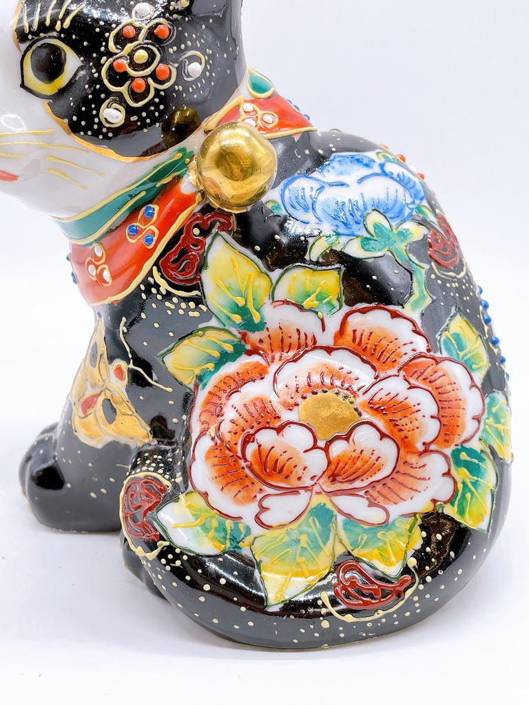 Japanese Kutani-style lucky cat with black butterfly design