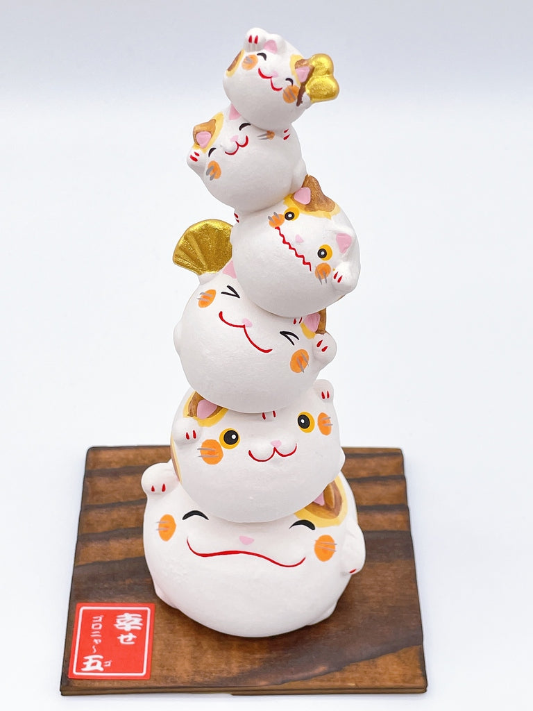 Japanese lucky cat symbolizing happiness.
