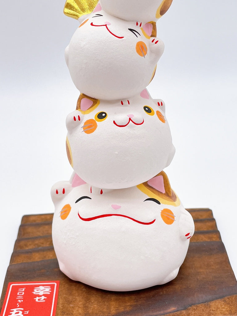 Japanese lucky cat symbolizing happiness.