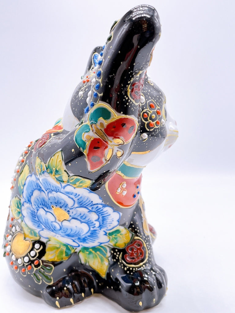 Japanese Kutani-style lucky cat with black butterfly design