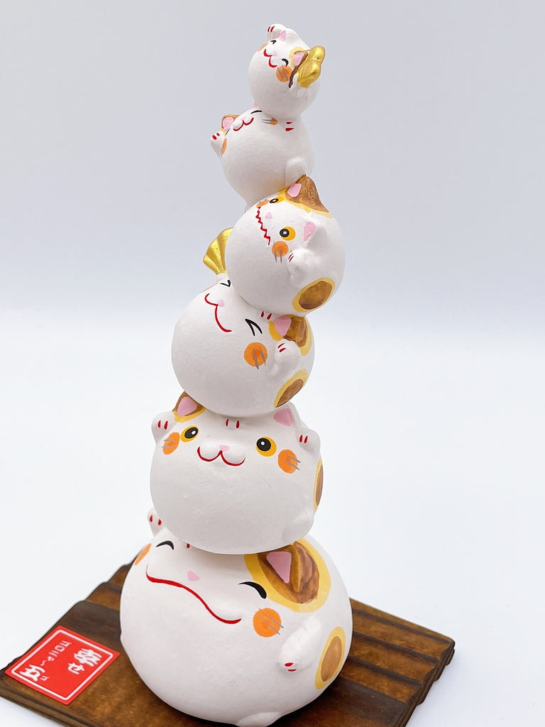 Japanese lucky cat symbolizing happiness.