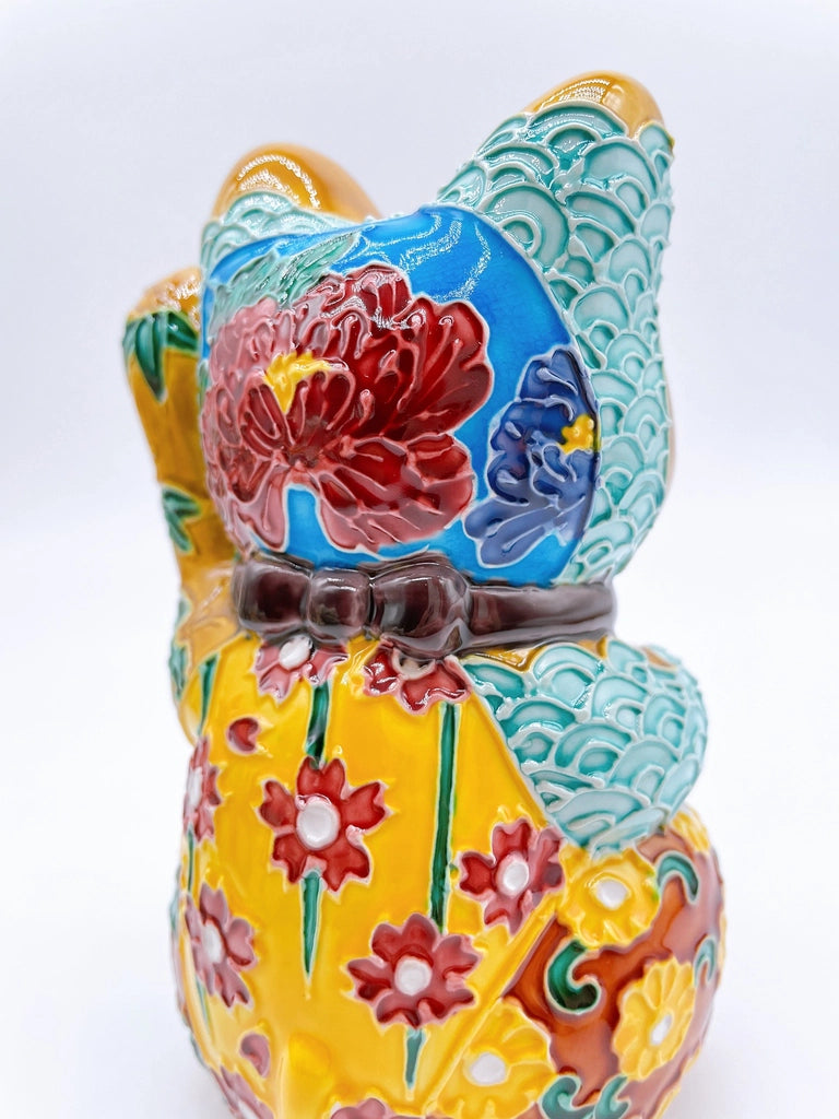 Japanese Kiyomizu-style lucky cat with a yellowish-brown base.