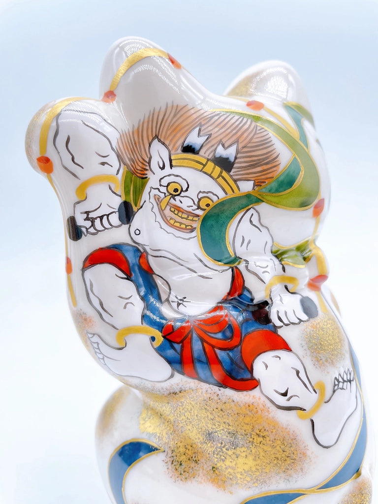 Japanese Kiyomizu-yaki lucky cat image with wind and thunder gods.