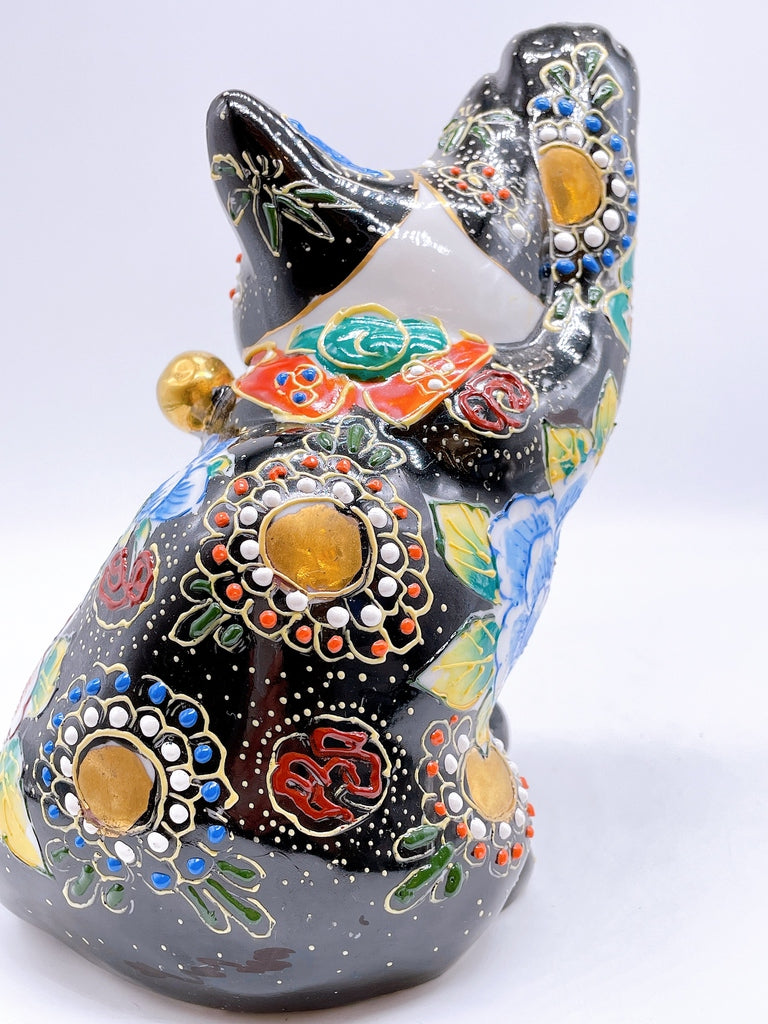 Japanese Kutani-style lucky cat with black butterfly design