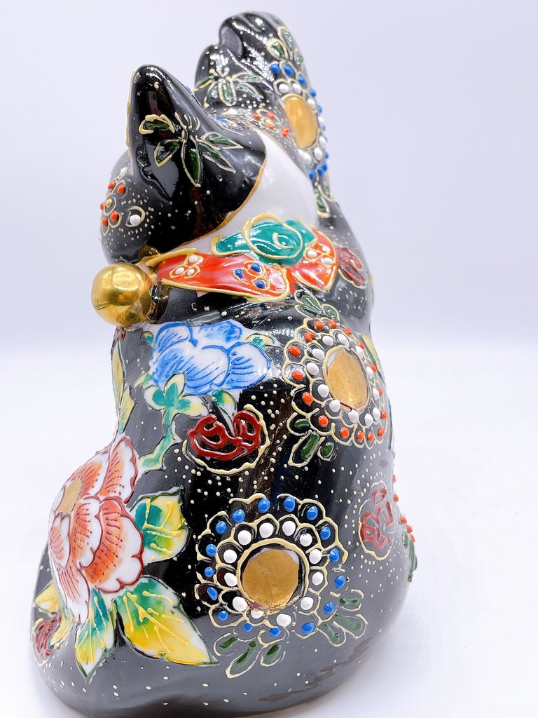 Japanese Kutani-style lucky cat with black butterfly design