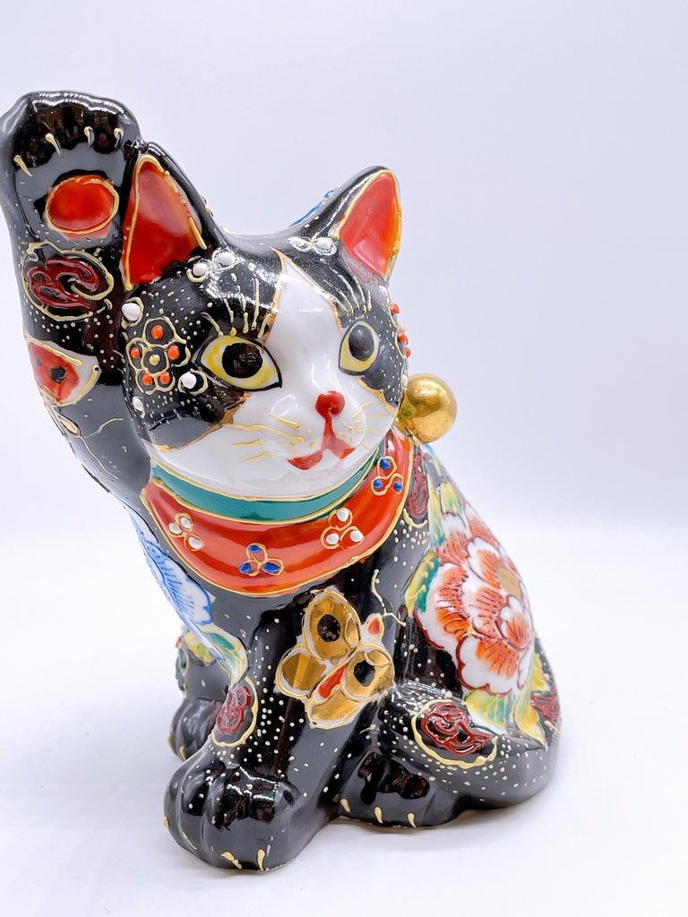 Japanese Kutani-style lucky cat with black butterfly design