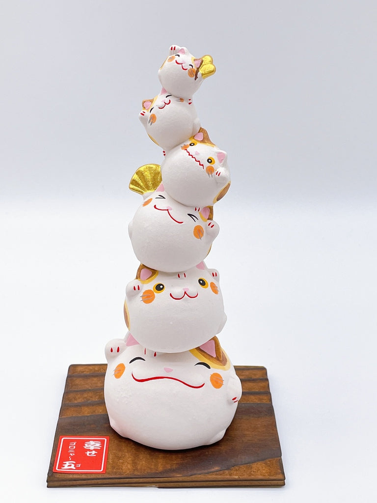 Japanese lucky cat symbolizing happiness.